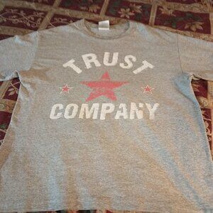 1. It is a Grunge Rock Band Trust Company t-shirt. The size is a Men's Medium.